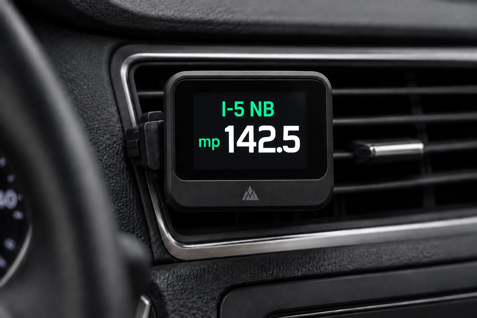MileCheck dash display, vent-mounted, showing I-5 NB mile marker 142.5