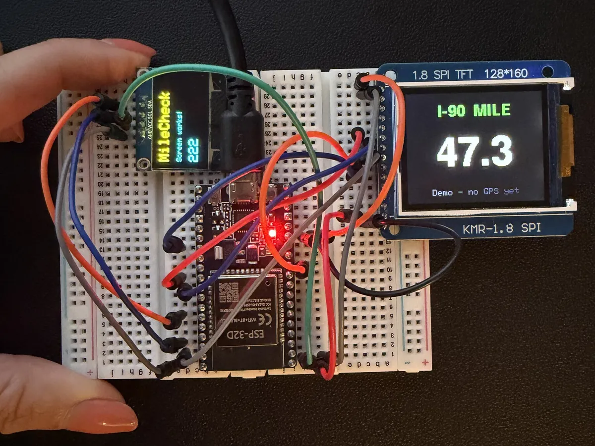 First prototype of the MileCheck mile marker display on a breadboard. The color screen reads I-90 MILE 47.3.